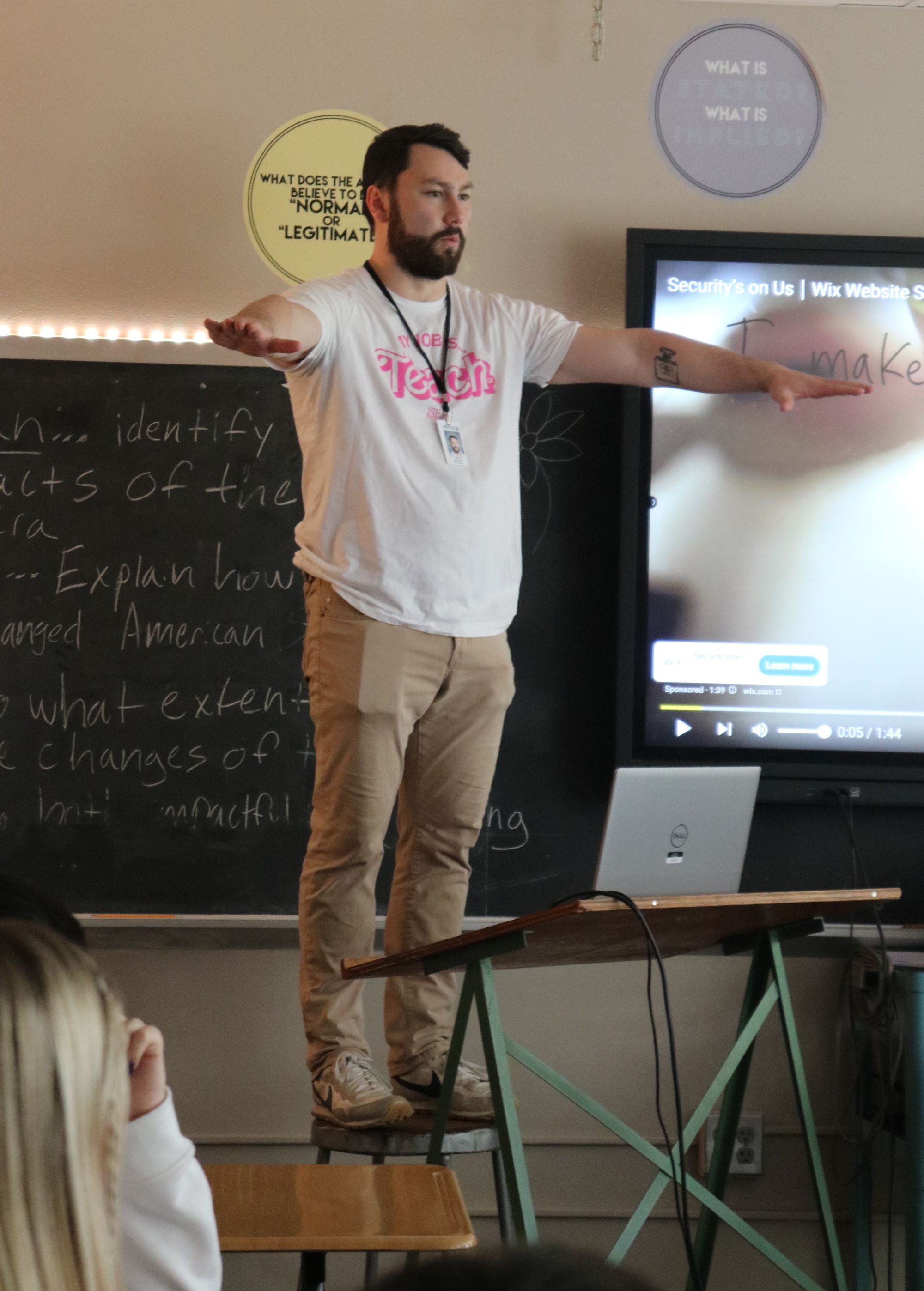 Teacher at the front of the class. 