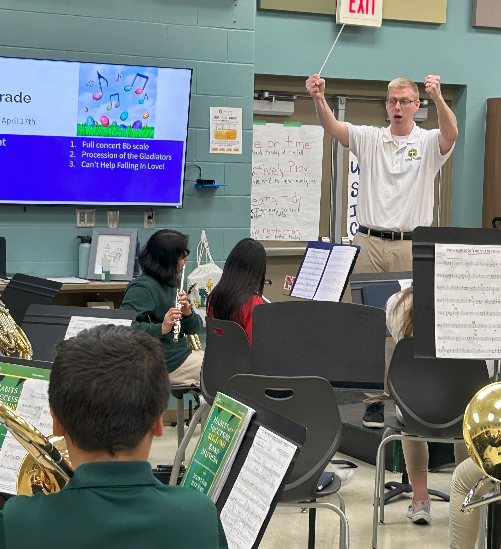 RAPIL Alum conducts a middle school band rehearsal